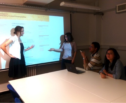 Image: Student volunteers from King’s College London discuss the design of the website for the SNAP:DRGN project